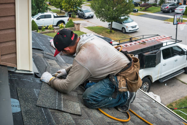 Professional Storm Damage Roof Repair technician working in Whitewater, WI